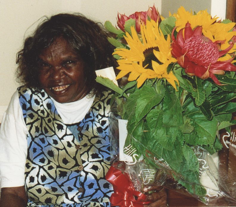Dorothy Napangardi with a gift of flowers.